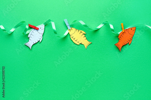 Paper fishes on color backg...