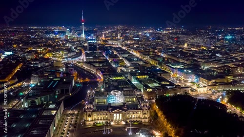 BERLIN, GERMANY - MAY,2019: Aerial drone timelapse hyperlapse view of Berlin city centre from above at night.