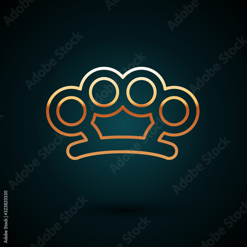 Gold line Brass knuckles icon isolated on dark blue background. Vector Illustration