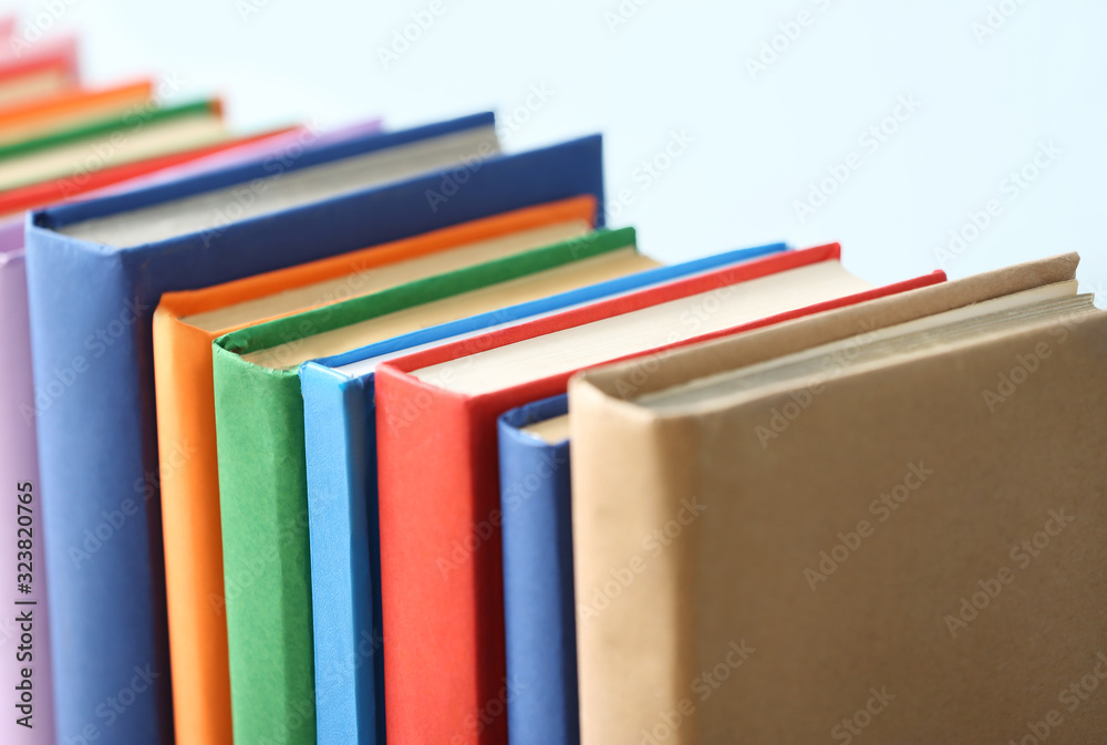 Many books on light background, closeup Many books on light background, closeup
