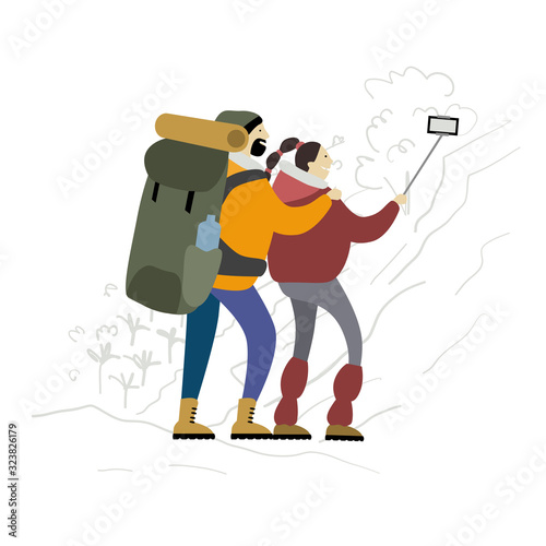 Couple of Hikers with backpacks takes selfie in mountains