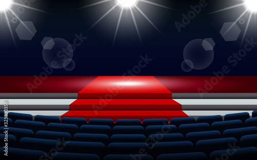 chairs and stage with spotlight in the hall	