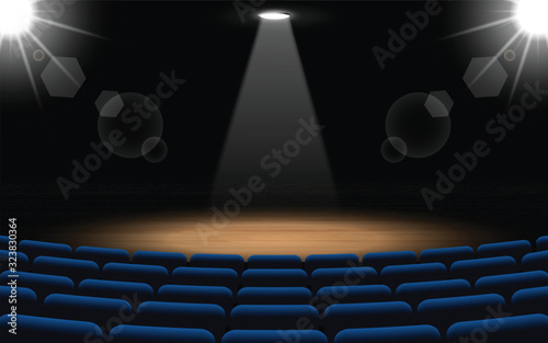 chairs and stage with spotlight in the hall	