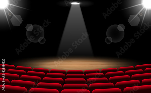 chairs and stage with spotlight in the hall	