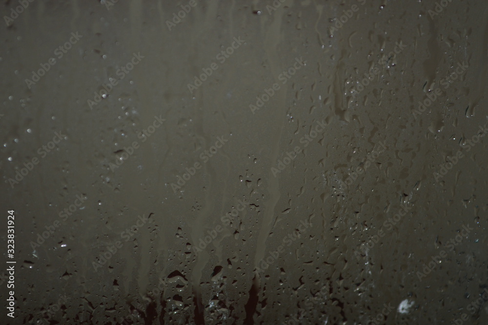 The patterned surface of the bathroom glass with steam The patterned surface of the bathroom glass with steam