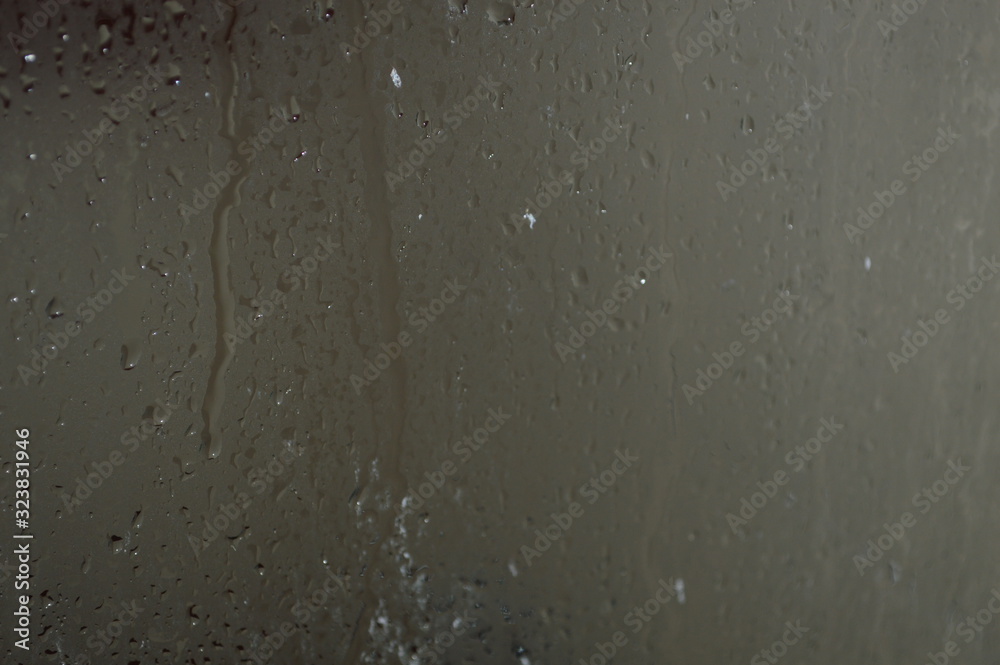 The patterned surface of the bathroom glass with steam The patterned surface of the bathroom glass with steam