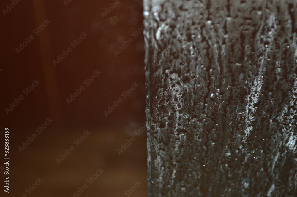 The patterned surface of the bathroom glass with steam The patterned surface of the bathroom glass with steam