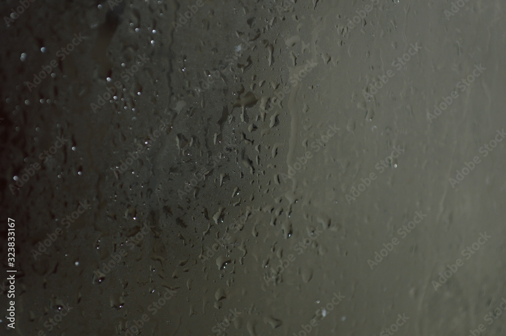 The patterned surface of the bathroom glass with steam The patterned surface of the bathroom glass with steam