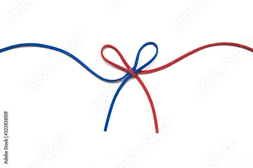 red and blue ribbon isolated on white background. two colors chamois string tied in a bow. 