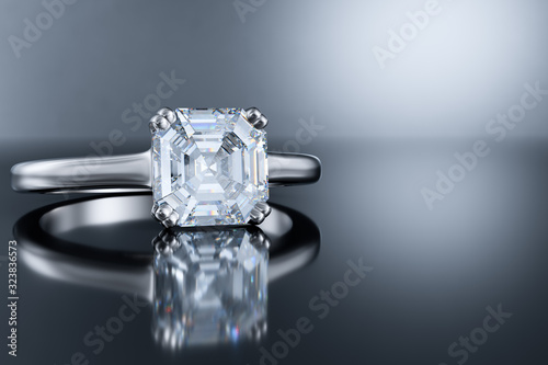 Canvas Print Asscher solitaire engagement diamond ring on gray glossy background