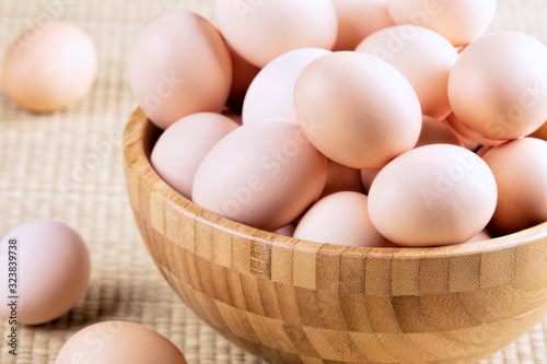 A background of farm fresh brown eggs