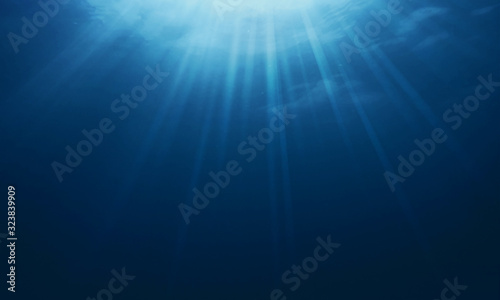 Beautiful Underwater sea with sunlight through in the underwater Summer background concept