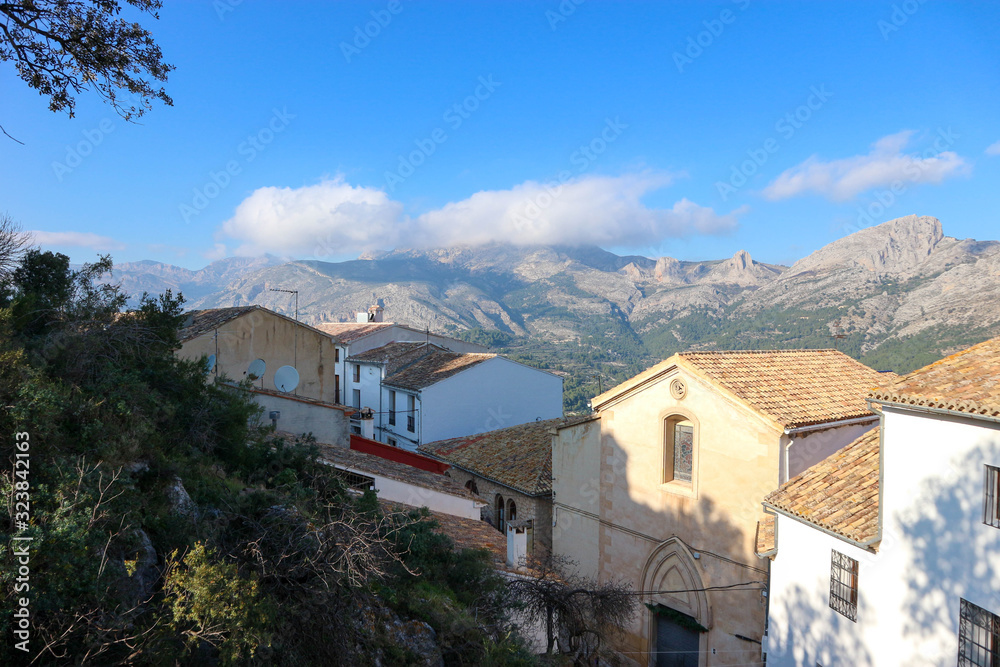 view of the town of Castell de Guadalest with the mountains on the background