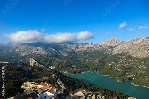 Panoramic view to beautiful azure Guadalest reservoir lake surrounded by mountains from the castle, Spain © Sergei Timofeev