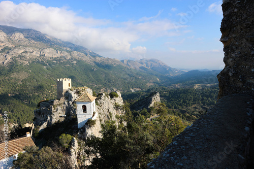 View to Castillo de la Alcozaiba with scenic mountain landscape on the background in Castell de Guadalest, Spain