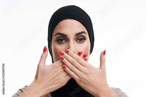 Scared muslim woman over white background