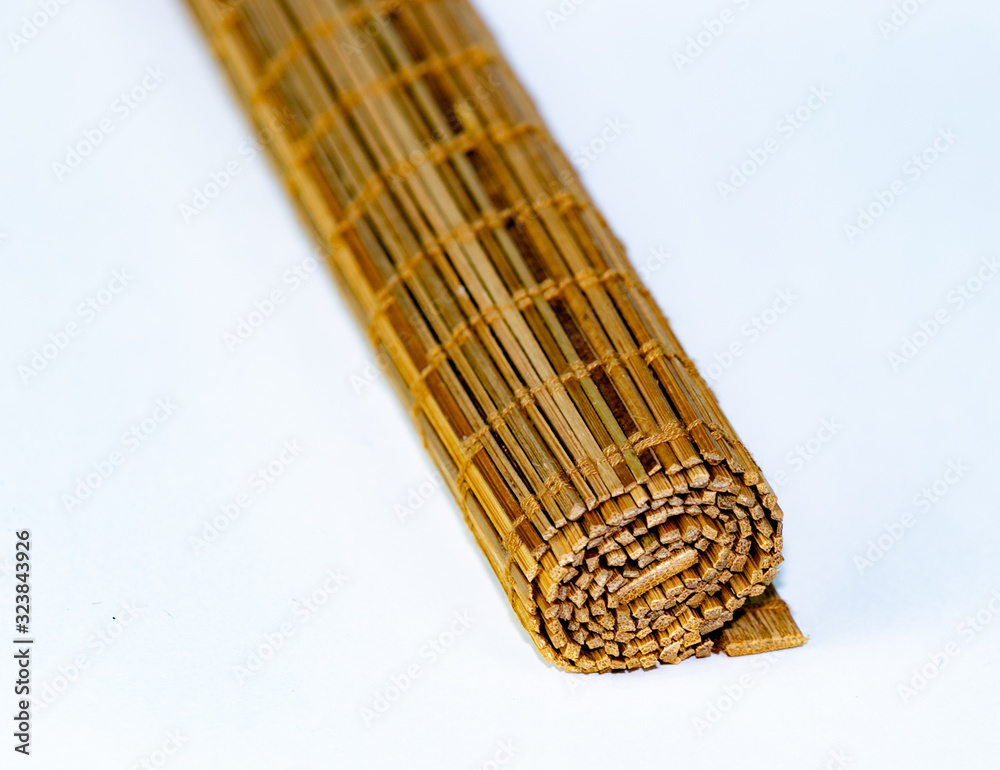 Bamboo sushi rolling mat isolated on white background Bamboo sushi rolling mat isolated on white background