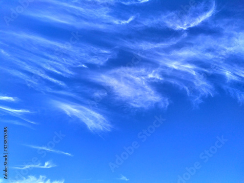 Blue sky background and white clouds soft focus, and copy space © rajiv