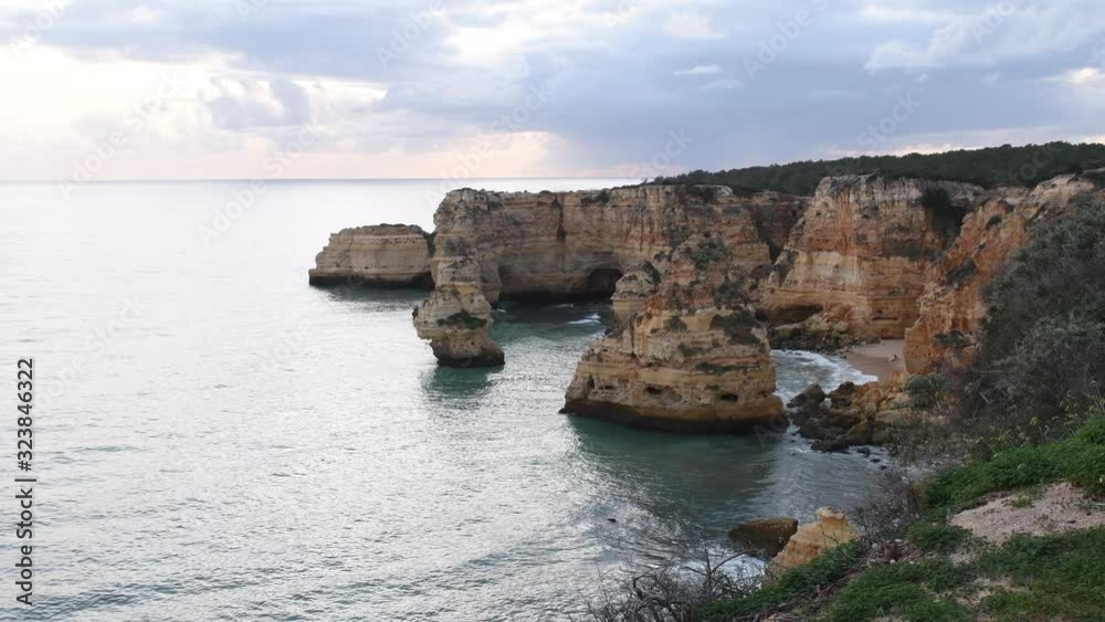 Clifftop view from above Praia da Marinha, Marinha Beach, Lagos, Algarve. Video of late afternoon view. Top view of one of Portugal’s best beaches. Clifftop view from above Praia da Marinha, Marinha Beach, Lagos, Algarve. Video of late afternoon view. Top view of one of Portugal’s best beaches.