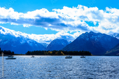 Blue Colored Wtare and Sky near the lake in the Grand Teton National Park, Arizona, USA photo