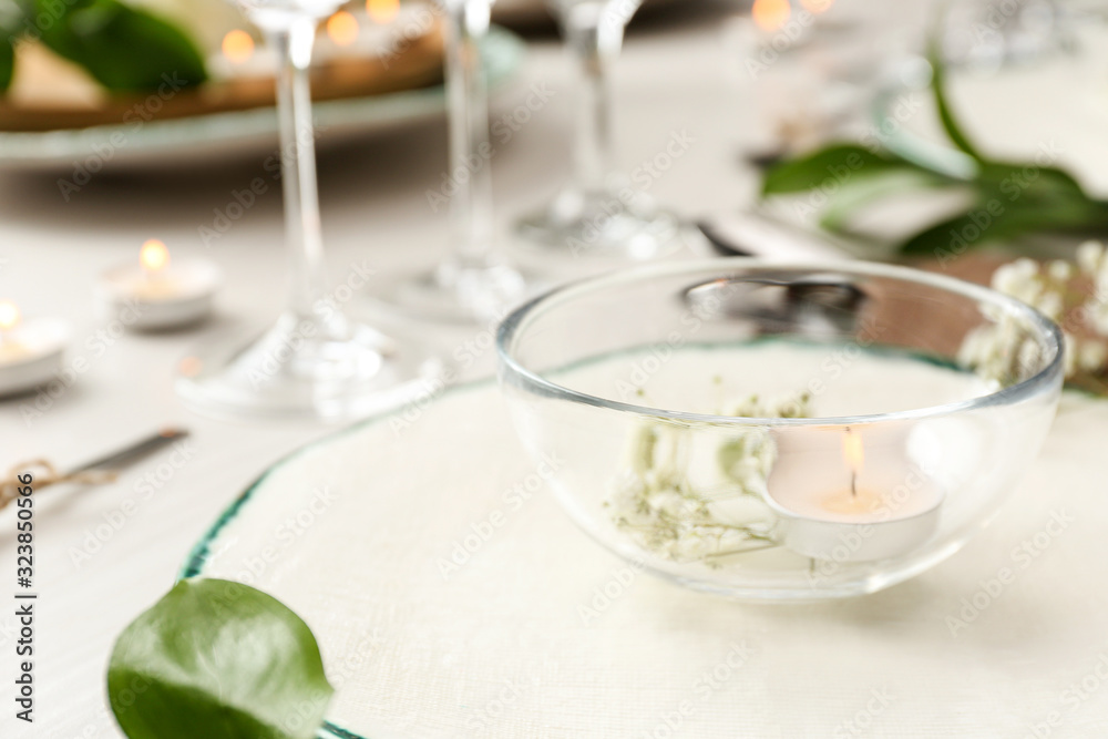 Elegant table setting with green plants, closeup