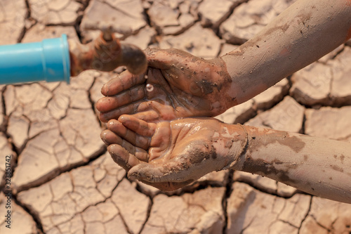 on dry ground, concept hope and drought