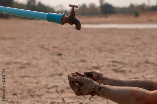 on dry ground, concept hope and drought