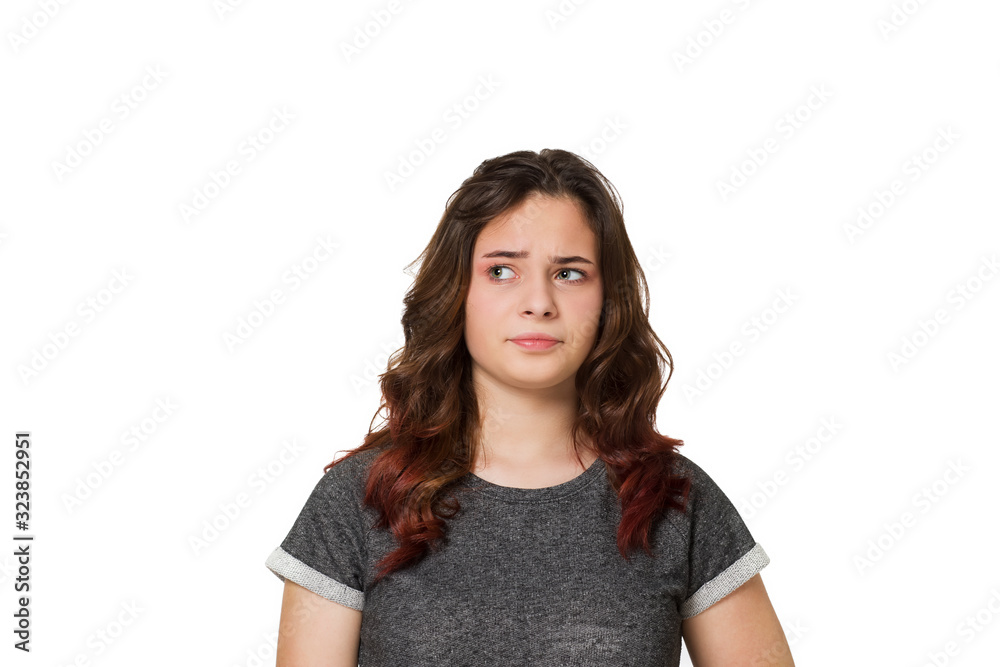 Young teenager thinking over a white background Young teenager thinking over a white background