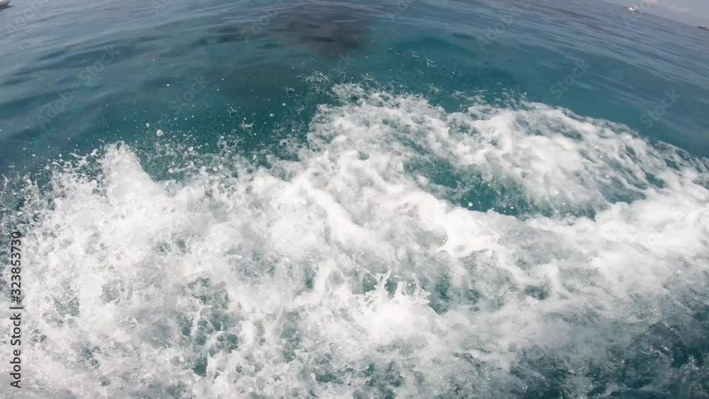 4k close-up of sea waves with foam from a speed boat trace 4k close-up of sea waves with foam from a speed boat trace