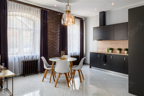 Spacious living room in white-brown tones