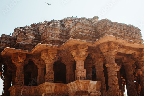 Closeup shot of the carved pillars of the Sun Temple in Modhera, Gujarat, India photo