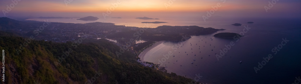 Aerial panorama of Phuket island and Nai Harn beach before sunrise. Thailand