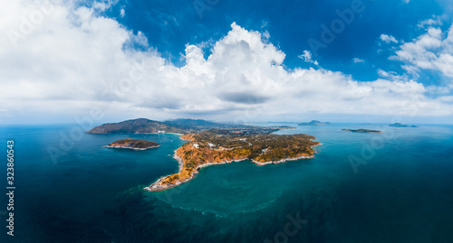 Aerial panorama of the southernmost area of Phuket island with Promthep Cape and island around, Thailand