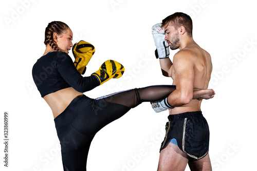 young adult woman doing kickboxing training with her coach isolated on white background with clipping path photo