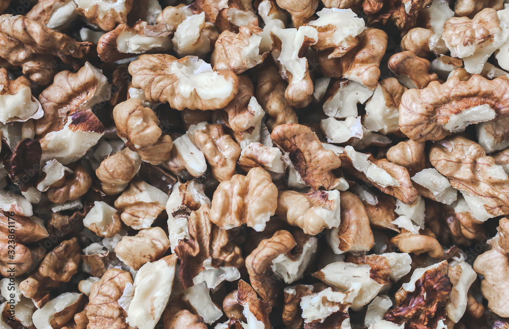 Shelled walnuts background. Nuts texture. Healthy energy vegan food. Superfood for hipster lifestyle. Shelled walnuts background. Nuts texture. Healthy energy vegan food. Superfood for hipster lifestyle.