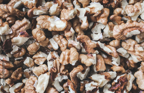 Shelled walnuts background. Nuts texture. Healthy energy vegan food. Superfood for hipster lifestyle.
