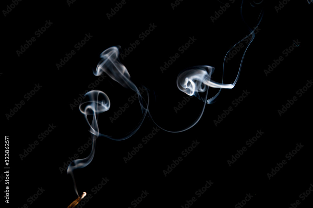 Clouds of smoke on black background