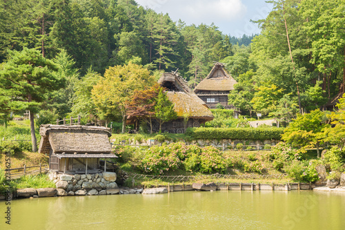 Photograph of an old Japanese village with a lake