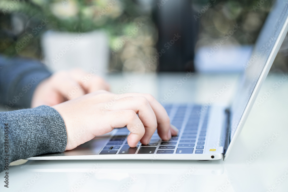 Woman working at home office using laptop searching web, browsing information Woman working at home office using laptop searching web, browsing information