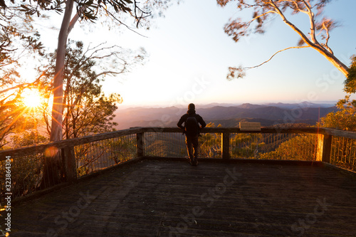 Bilde på lerret Man with vast mountain view from lookout at sunrise in Australia