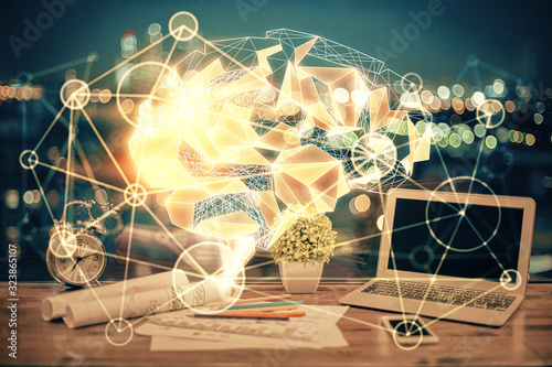 Multi exposure of work table with computer and brain hologram. Brainstorm concept.