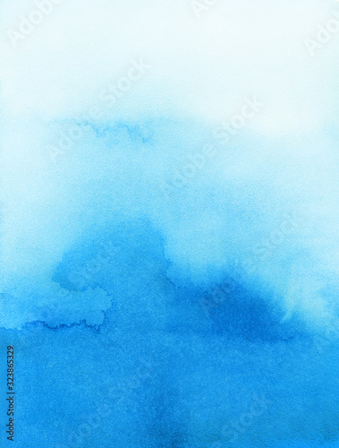 Hand painted blue watercolor background. Watercolor wash. Blue brush strokes background design isolated