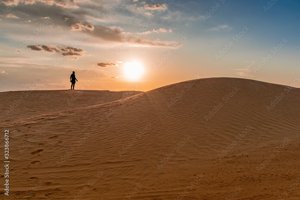 sand dunes of the Sahara desert lit by the light of the setting sun of the sun,