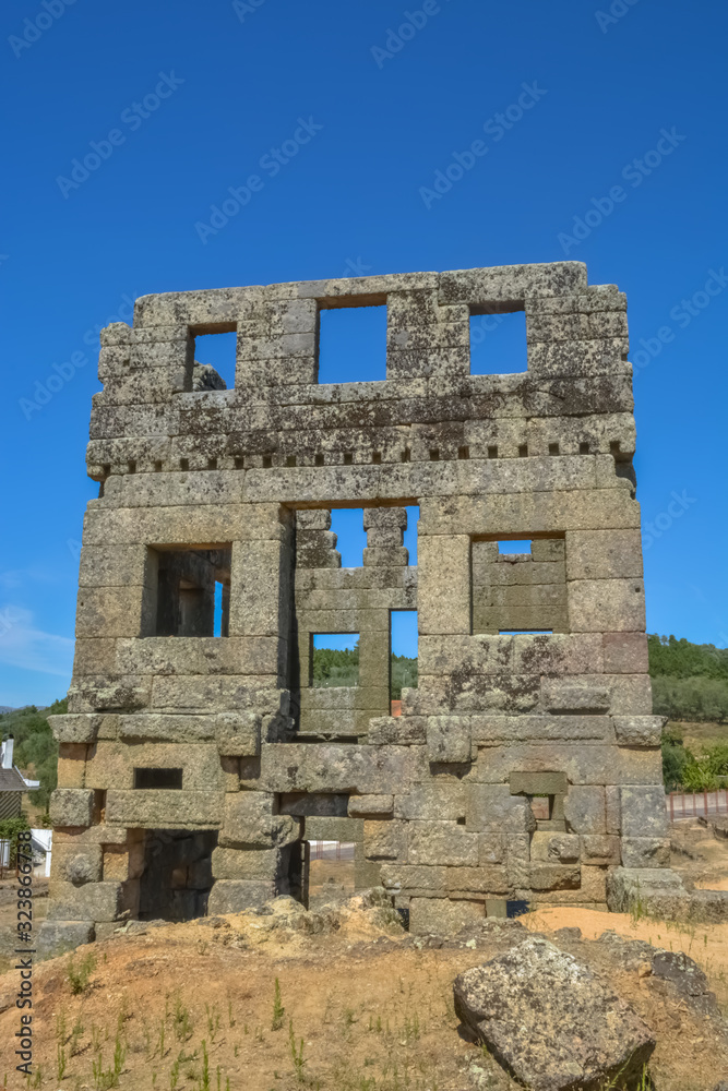 View at the exterior front facade of medieval Saint Cornélio tower, iconic ruins monument building at the Belmonte village, portuguese patrimony