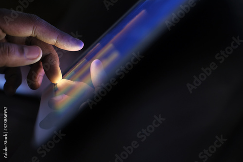 Φωτογραφία Close up of man hand analyzing chart on digital tablet.
