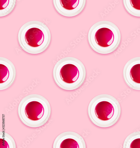 Colorful pink lip balm seamless pattern. Plastic jar with bright liquid for make-up on soft pastel backdrop. Main trend of the year