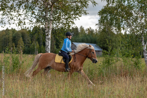 Woman horseback riding 