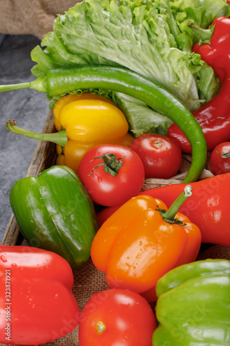 Colorful bell peppers with greenery. Top view.