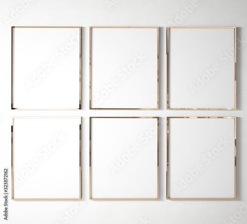 set of 6 Gallery Rose Gold Poster Frames hanging on white wall background in bright interior mock up, 3D rendering, illustration 
