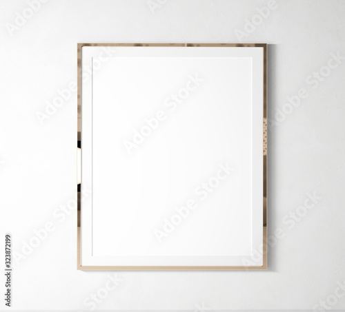 Blank vertical frame mock up poster, rose gold, placed on white wall. 3d illustration